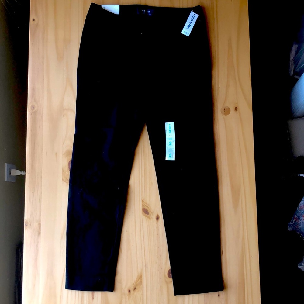Size 2. Solid black business pant. Never worn.